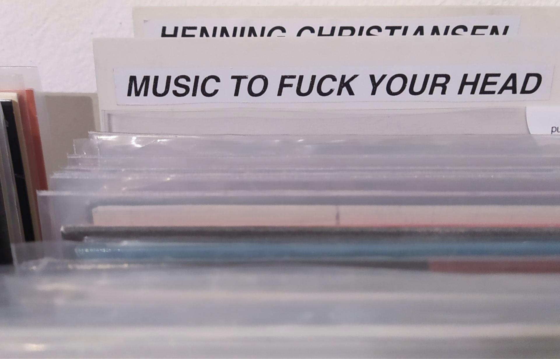 A section in a record stores that says "music to fuck your head"